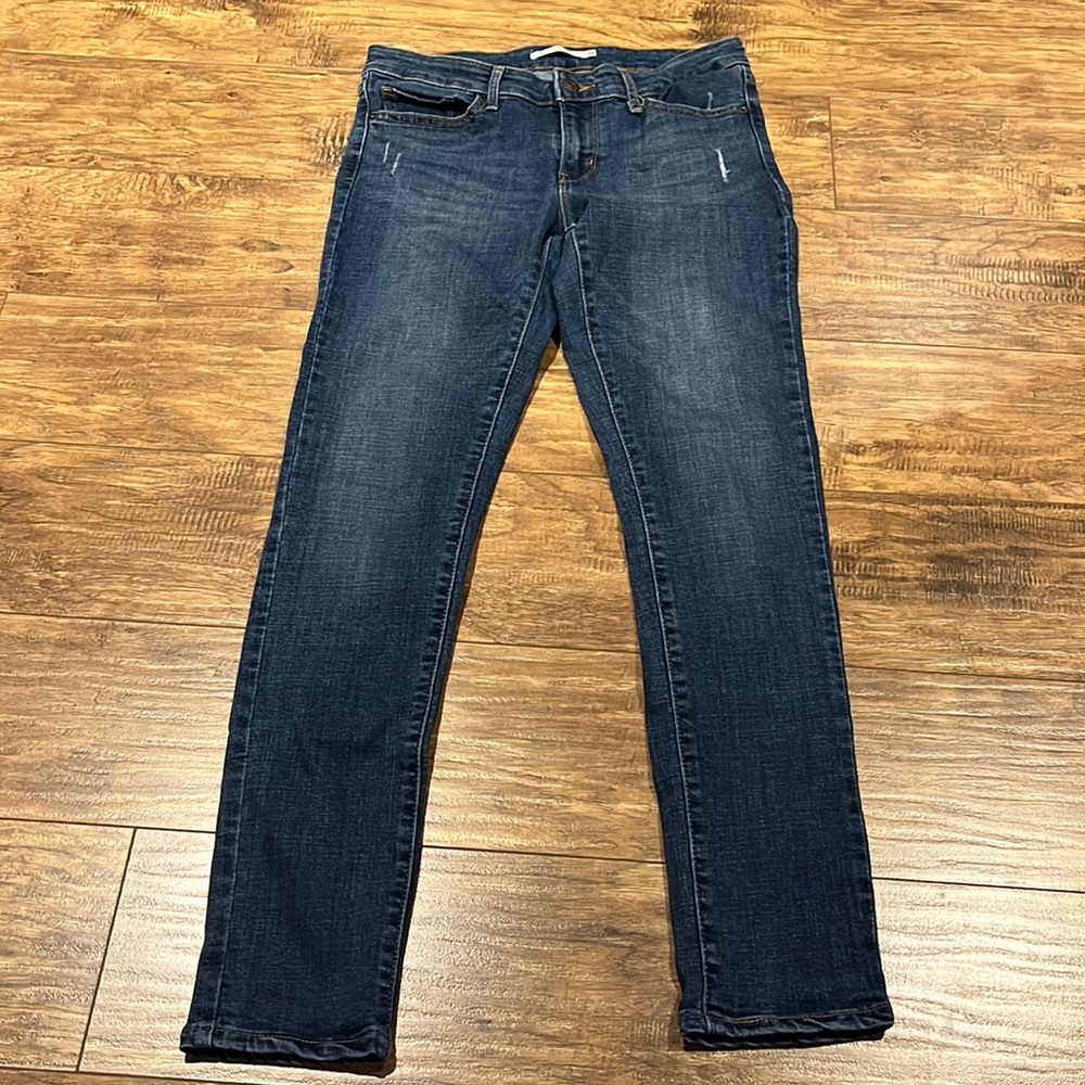 Levi’s 711 Skinny slightly distressed medium wash jeans